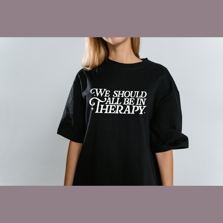 We Should All Be in Therapy Black Graphic Tee