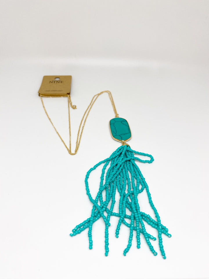 Nine Gold Pendant Tassel Necklace