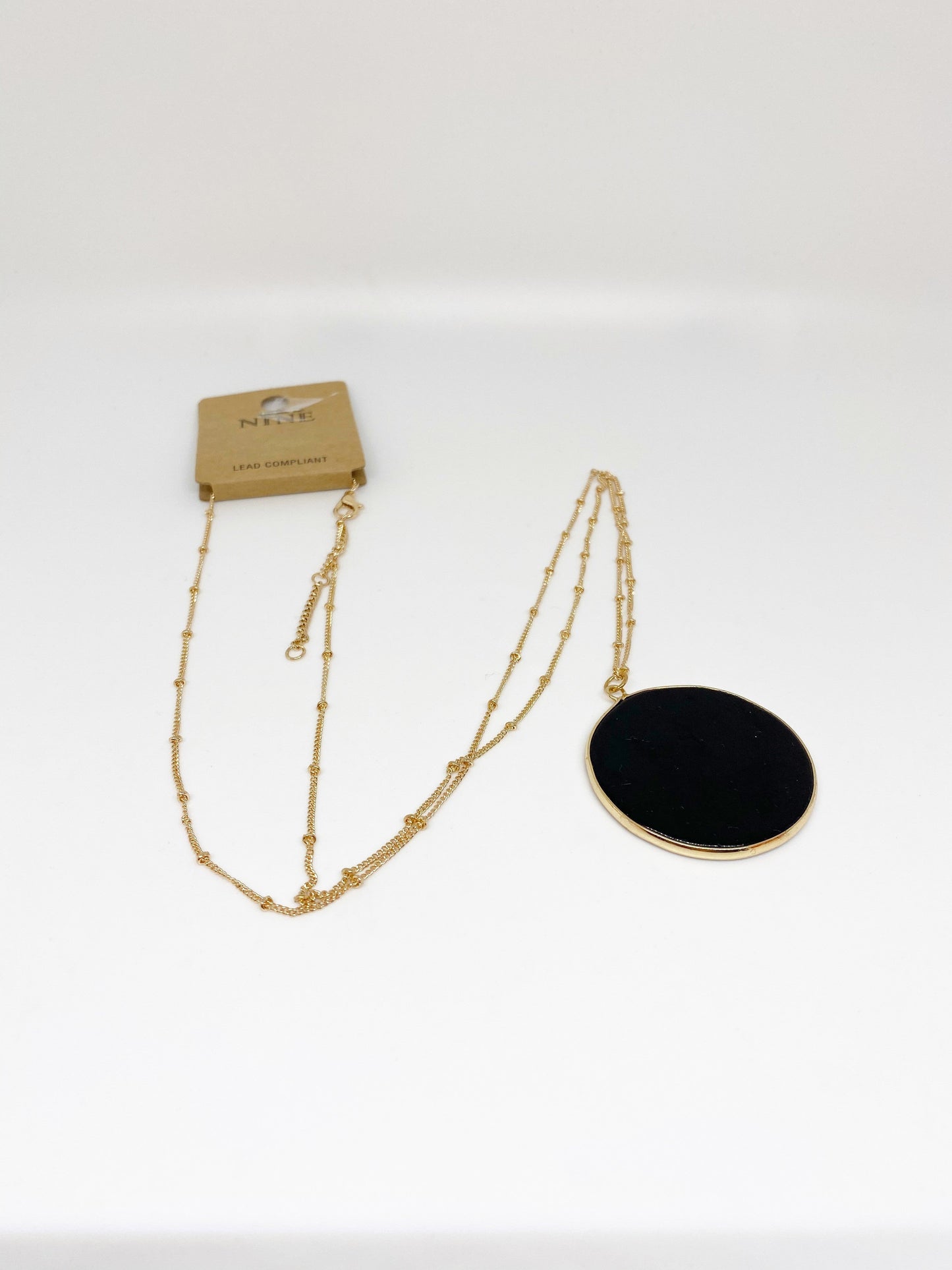 Nine Black Circle Pendant Necklace